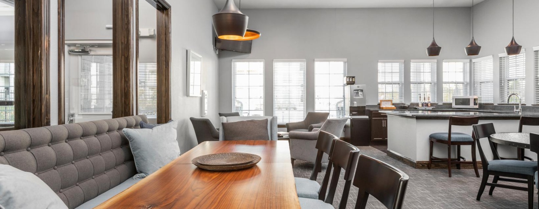 a large room with a table and chairs