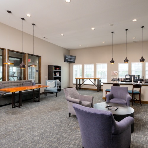 a large room with a table and chairs