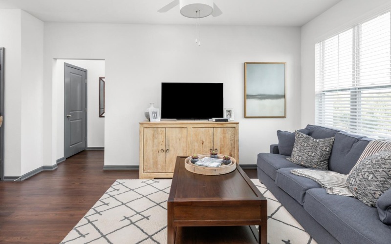 a living room with a couch and a table