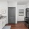 a kitchen with white cabinets